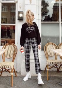 A sweatshirt and plaid pants